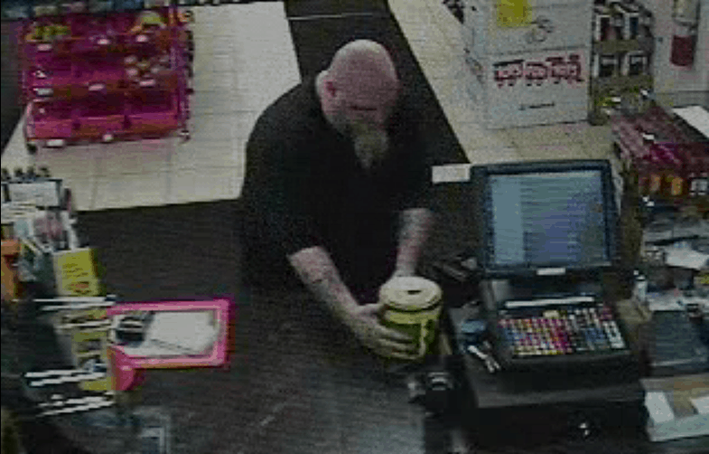 Police are looking for this man who took a Toys For Tots donation jar at a gas station in Winthrop Harbor