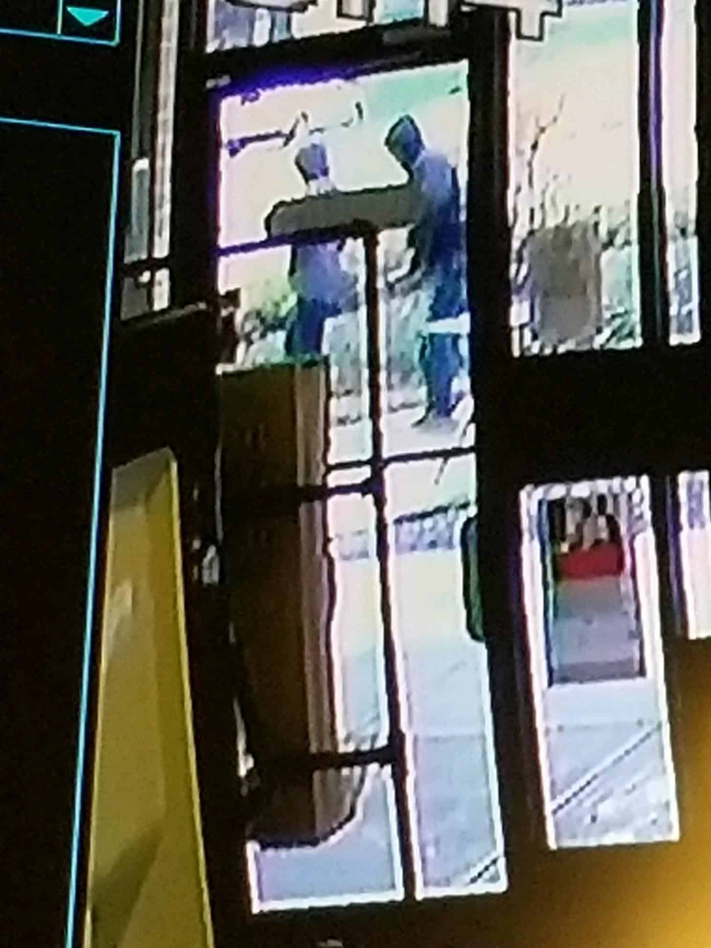 Surveillance footage of the attempted armed robbery (suspect on the right)