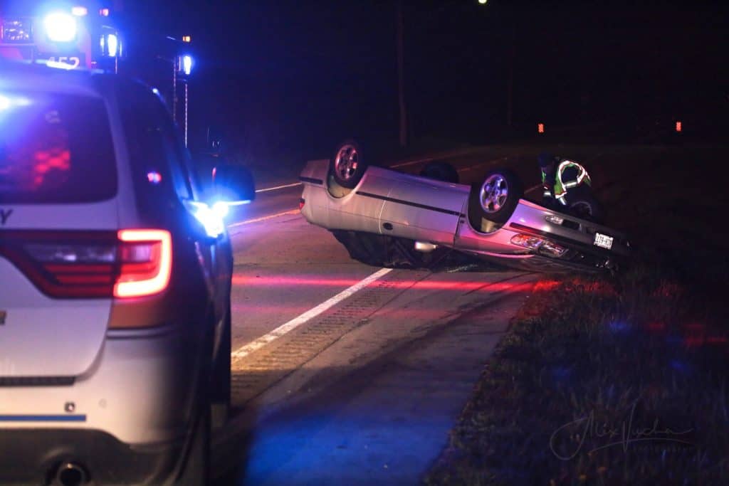 Video shows car hitting tow truck on side of road, rolling over near ...