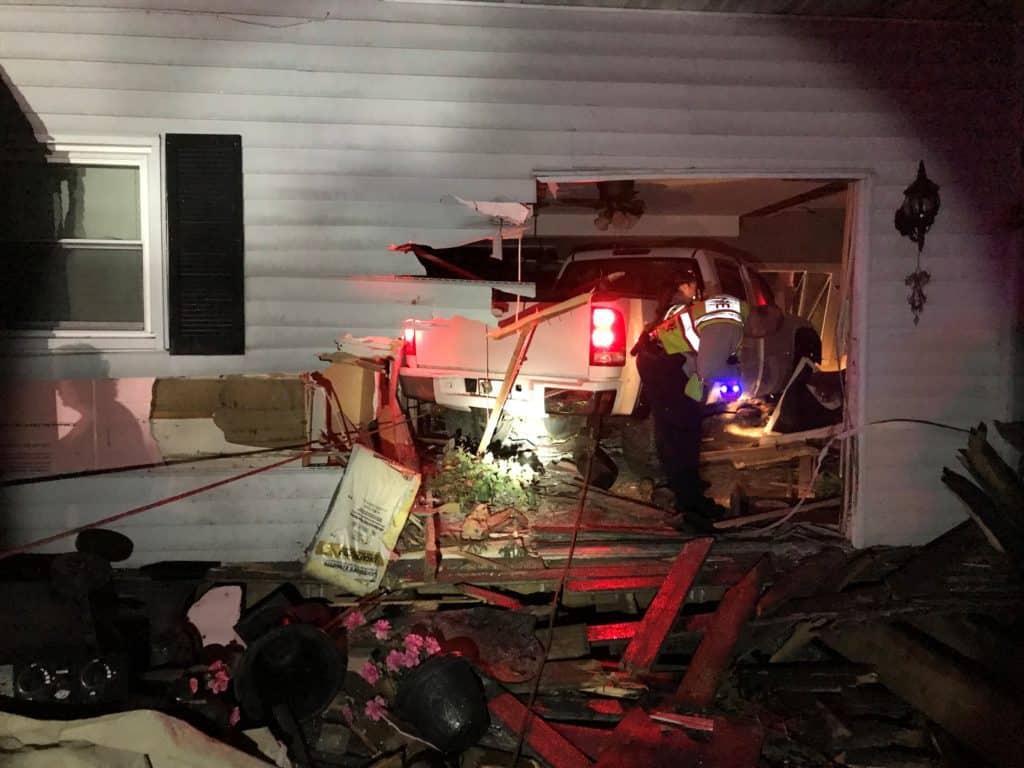 Pickup truck slams into Spring Grove home, pinning sleeping 71-year-old ...